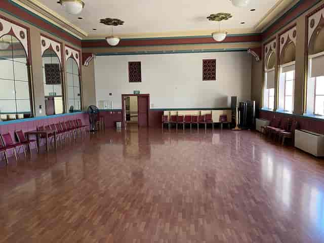 Spacious Lake Merritt ballroom with polished floors, ideal for events and workshops.