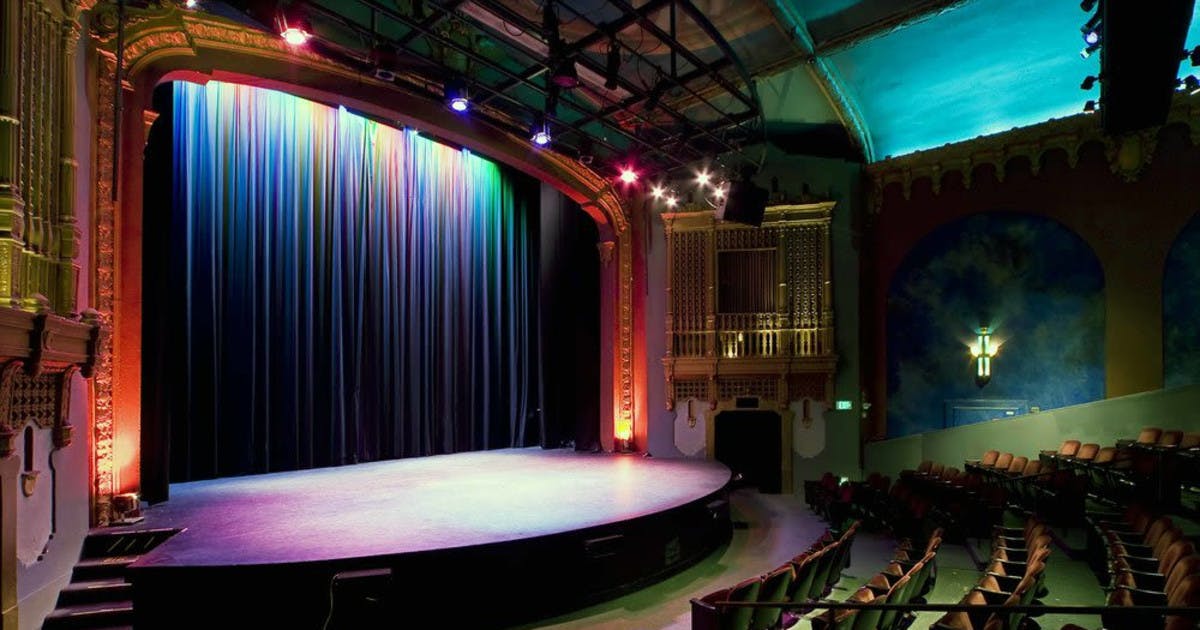 Brava Theater Center stage with vibrant lighting, ideal for performances and events.