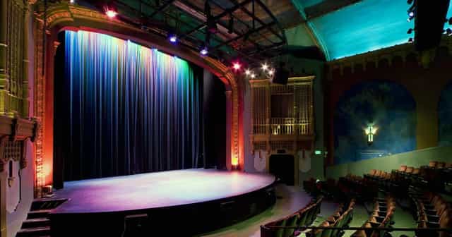 Brava Theater Center stage with vibrant lighting, ideal for performances and events.