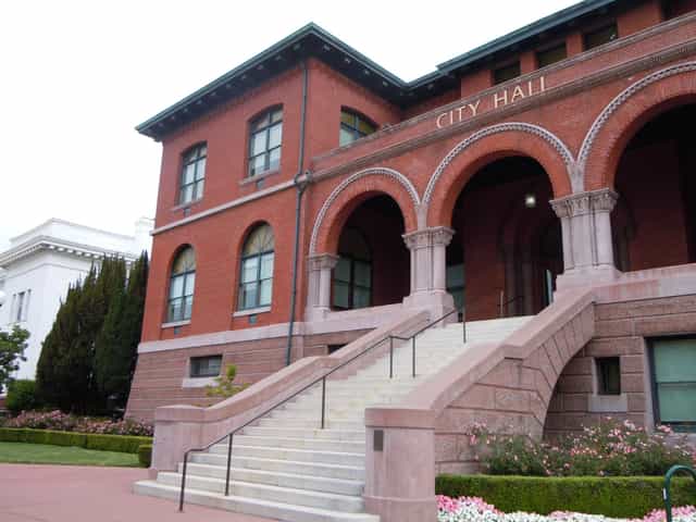 Historic Alameda City Hall with arched windows, ideal for civic events and meetings.