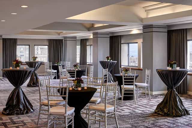 Elegant Union Square Ballroom with round tables, perfect for networking events and receptions.