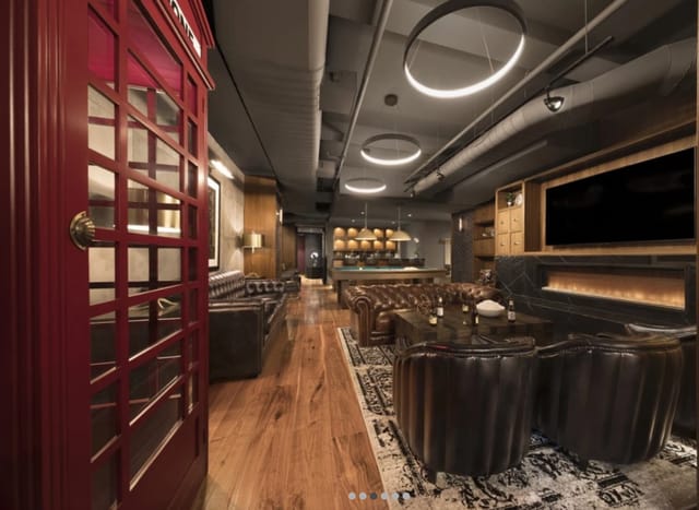 Modern meeting space in The Helm with cozy seating and private breakout area.
