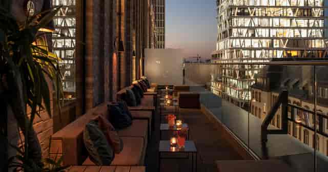 Grand Central Rooftop Bar with city skyline, perfect for evening events and gatherings.