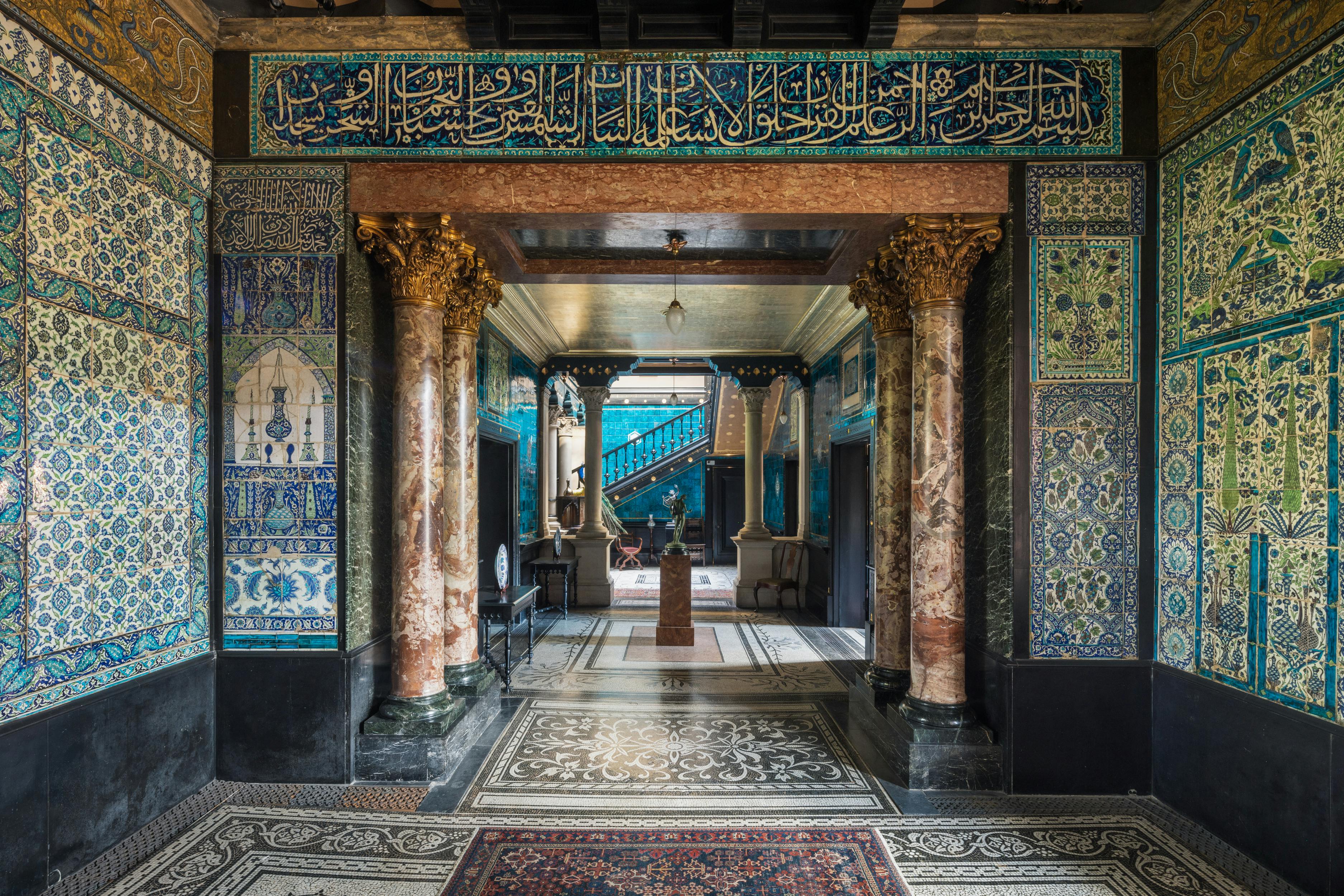 Corporate reception space with ornate columns, ideal for upscale events and gatherings.