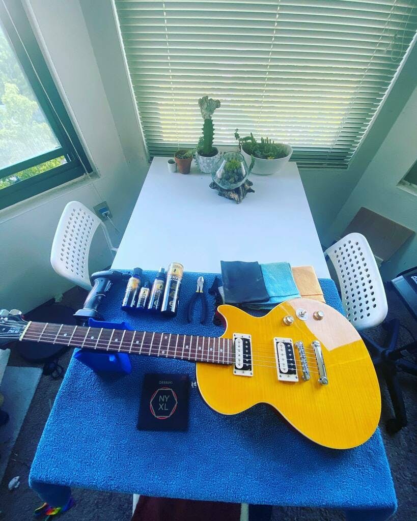 Recording studio workspace with guitar, tools for music workshop and creative event.