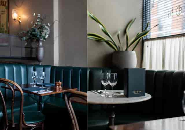 Stylish Bar & Bistro with plush green seating, ideal for intimate events and networking.