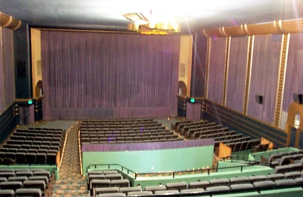 Vintage Presidio Theatre with plush seating, perfect for intimate events and performances.