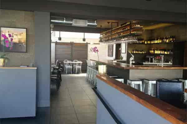 Modern venue with orchids, ideal for cocktail receptions and networking events.