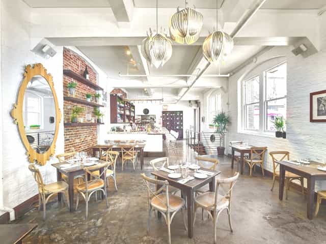 Stylish event space at 54 Mint Cucina Romana with rustic decor, ideal for gatherings.