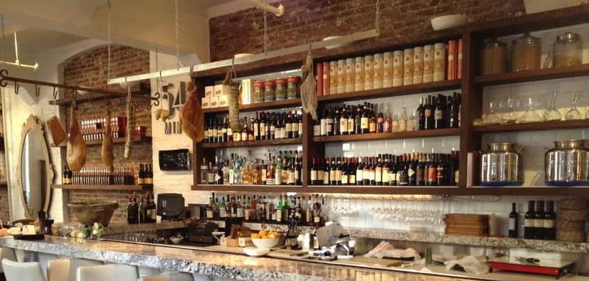 Stylish bar at 54 Mint Cucina Romana, ideal for networking events and cocktail receptions.