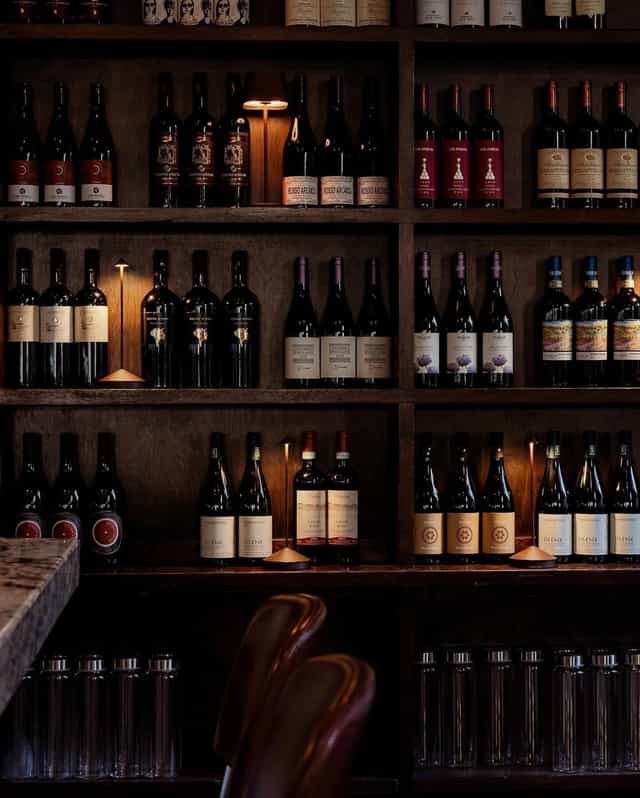 Wine display at 54 Mint Cucina Romana, ideal for tastings and events.