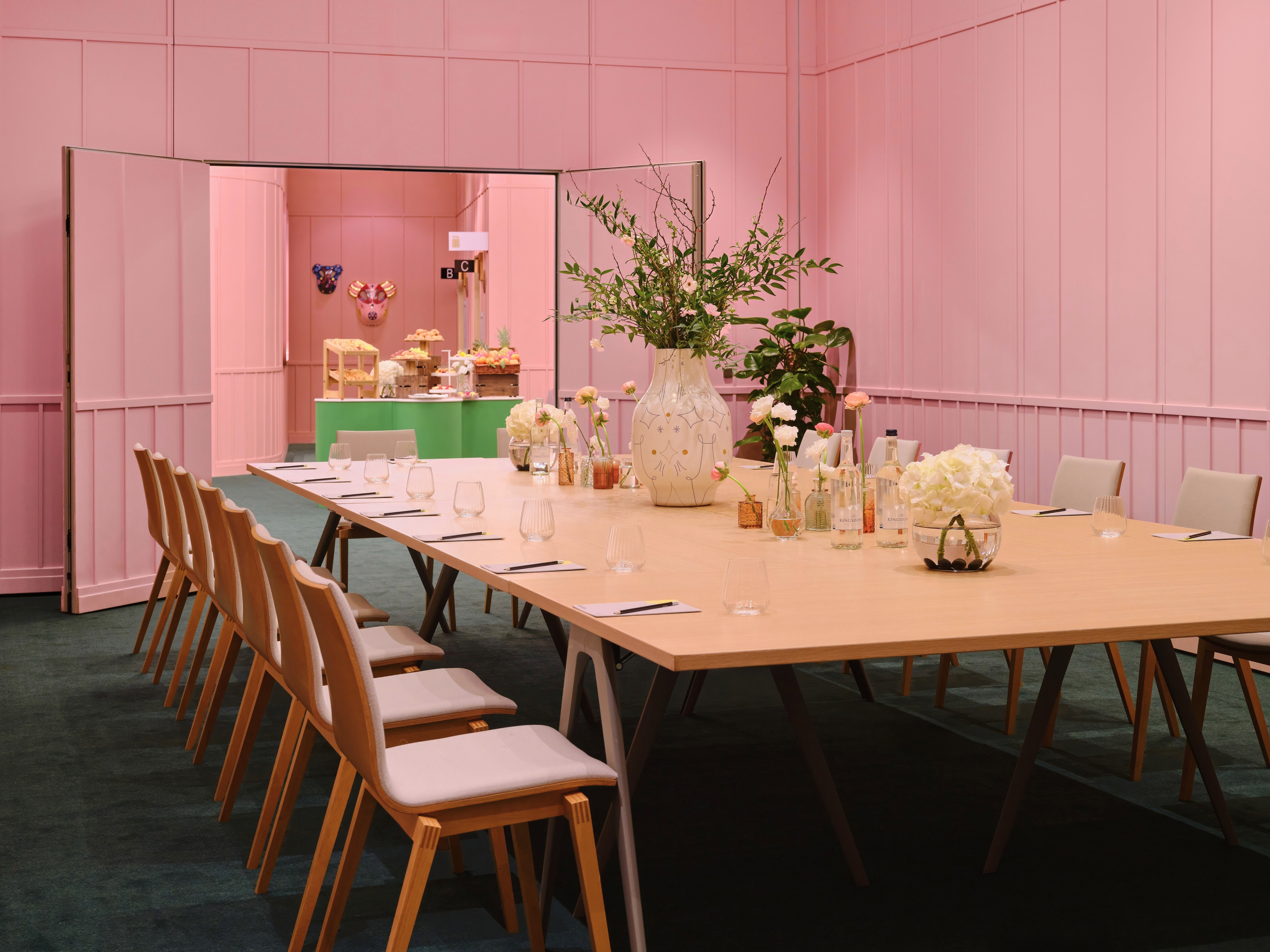 Stylish meeting room with pink walls, perfect for workshops at art'otel London Battersea. - Banner