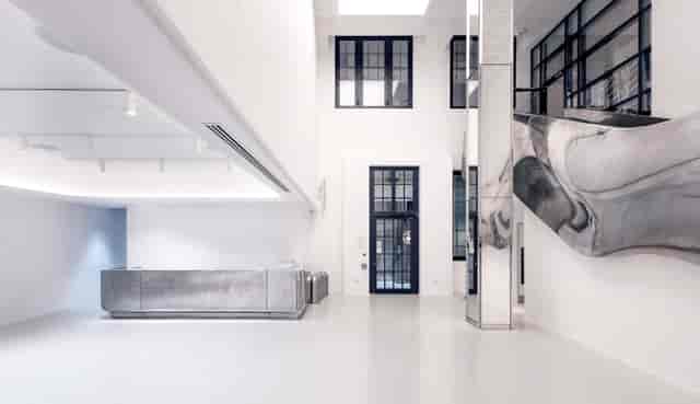 Modern event space, concrete desk, corporate events, modern party