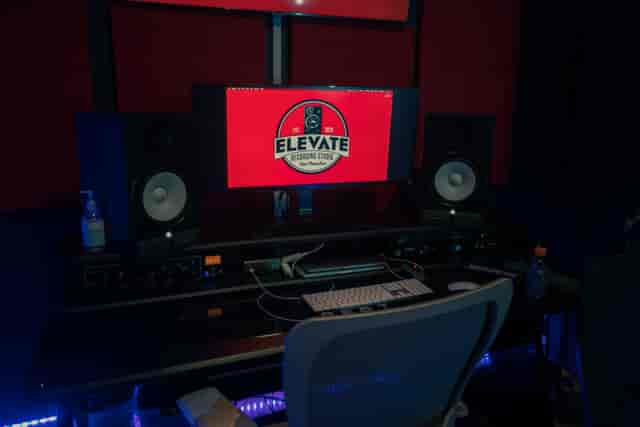 Modern recording studio with sleek workstation, ideal for music and podcast events.