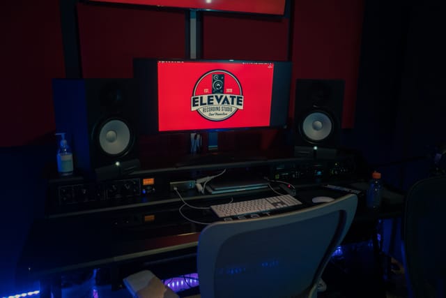 Modern recording studio with sleek workstation, ideal for music and podcast events.