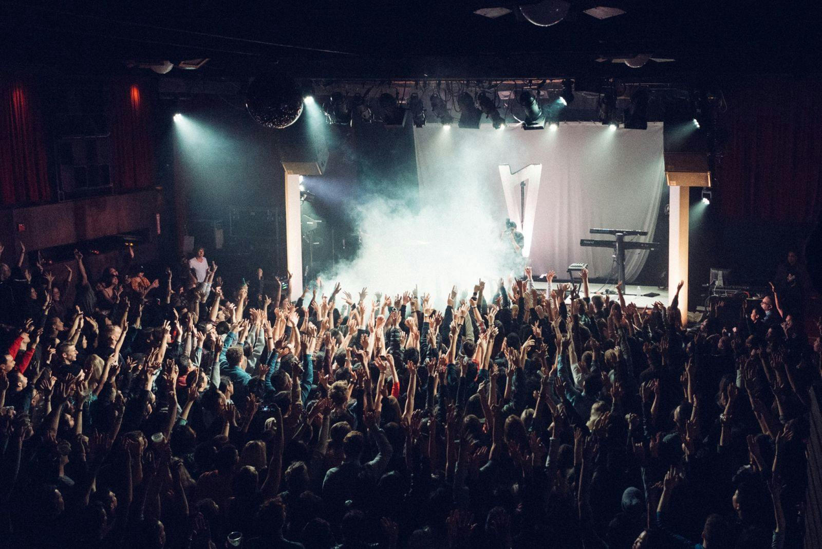 Vibrant concert at The Independent SF with excited audience and dynamic lighting.