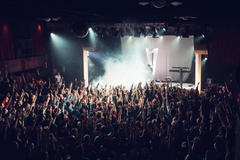 Vibrant concert at The Independent SF with excited audience and dynamic lighting.