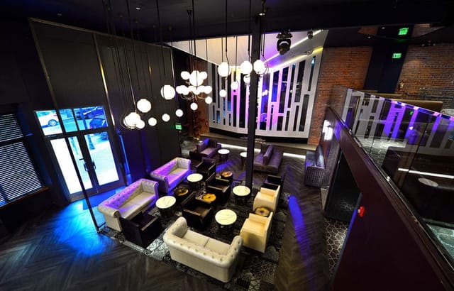 Stylish boutique nightclub with elegant lighting, perfect for cocktail receptions and gatherings.