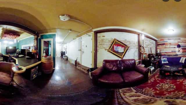 Cozy event space with exposed brick walls in Gulch Alley Studio for gatherings and meetings.