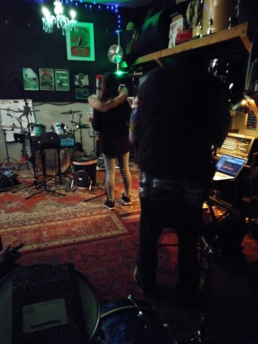 Dynamic rehearsal room with instruments, ideal for live performances and corporate events.