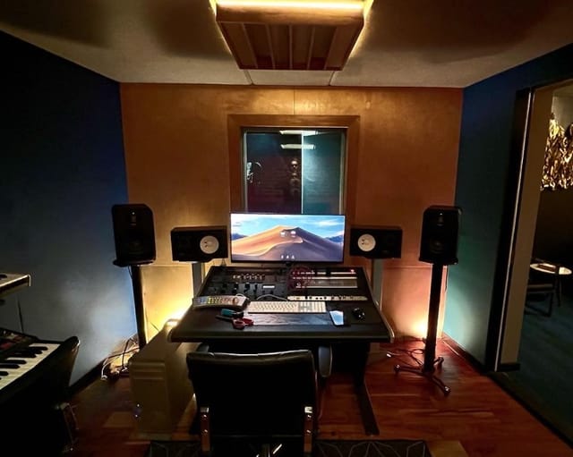 Modern audio recording studio with sleek setup, ideal for music events and workshops.