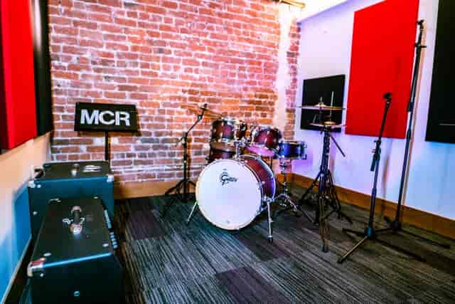 Vibrant rehearsal space with drum set in Studio 313, ideal for music events and workshops.