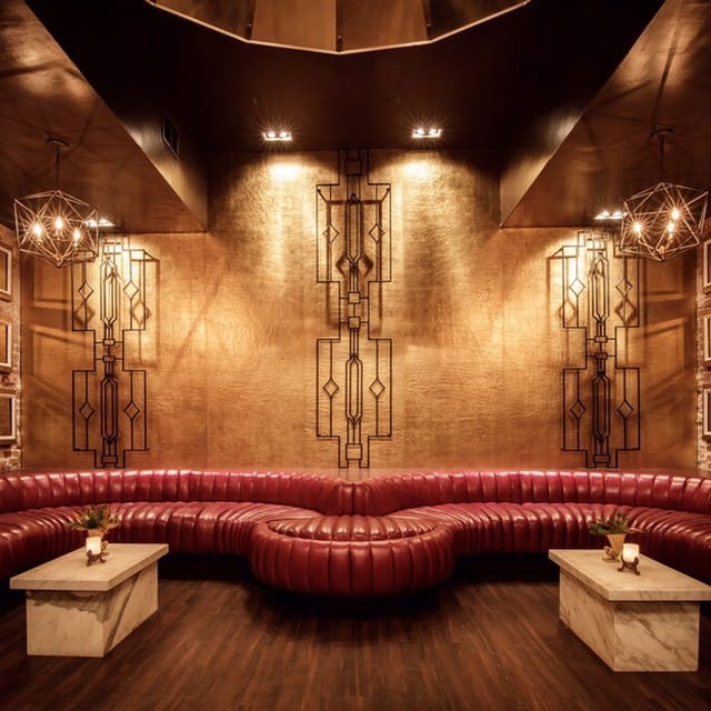 Intimate dance floor in Shimmytown with red leather seating for networking events.