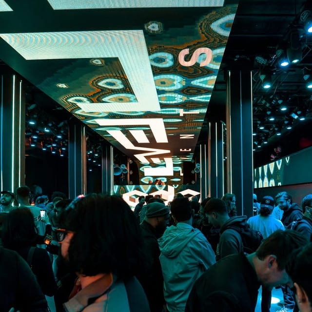 Vibrant dance floor in Shimmytown with dynamic lighting for networking events.