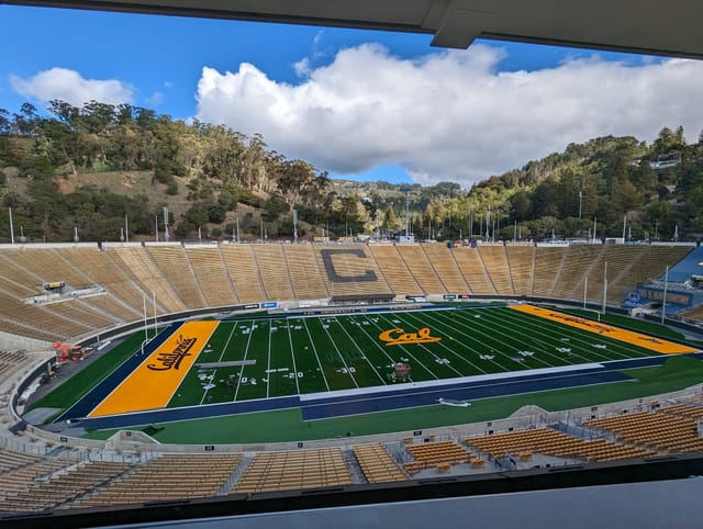 California Memorial Stadium with green football field, ideal for sports and events.