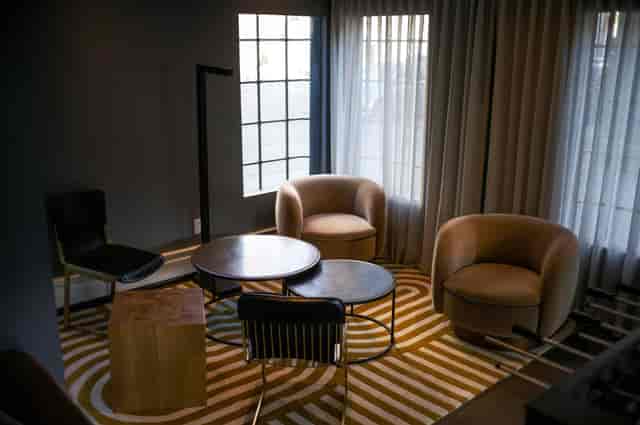 Stylish meeting space at Hotel Garrett with plush seating for intimate gatherings.