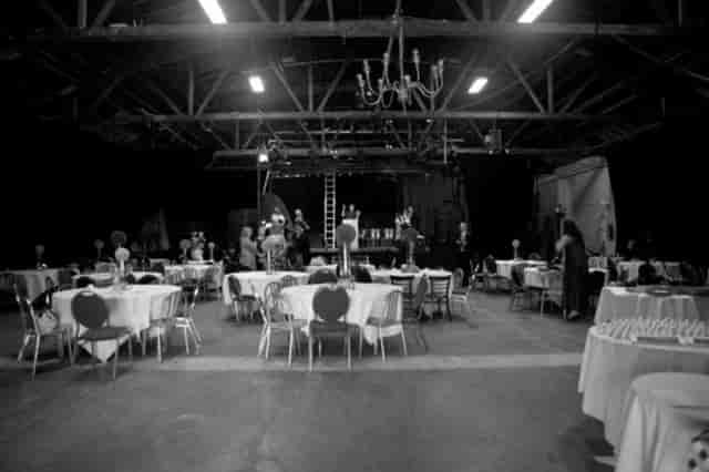 Operahouse Oakland venue with round tables, elegant decor for a lively event.