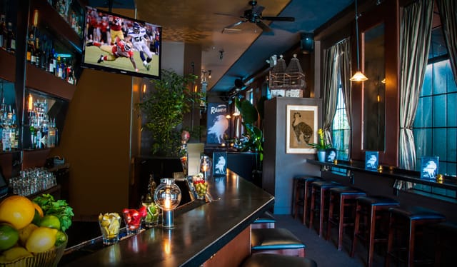 Stylish Club Raven bar with ambient lighting for networking events and casual gatherings.