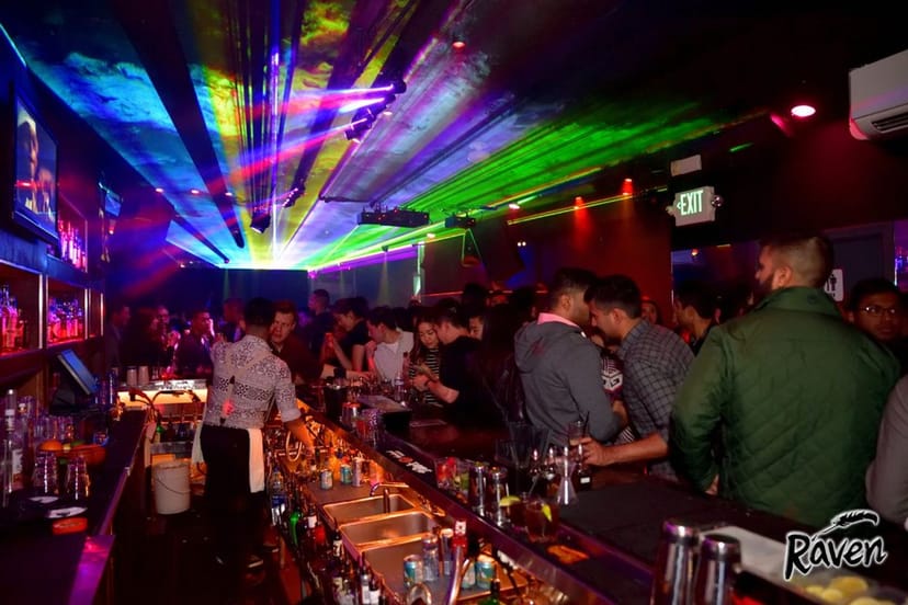 Vibrant nightlife at Club Raven with colorful laser lights for events and parties.