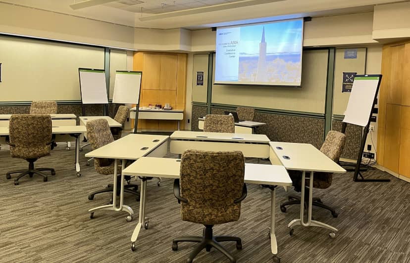 San Francisco Writers Conference meeting room with U-shaped tables for collaboration.