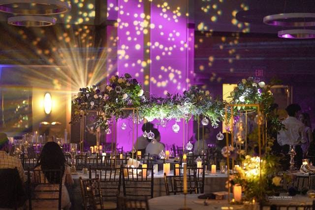Elegant event space with floral centerpiece for weddings and corporate events.