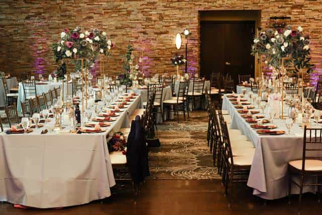 Elegant banquet setup with floral centerpieces for weddings and formal events.