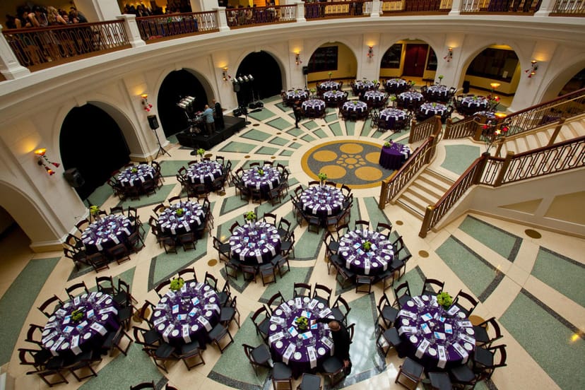 Elegant event space in Rotunda Building with purple linens, ideal for galas and corporate functions.
