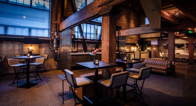 Stylish industrial-chic event space at Restaurant + Social for private dinners and receptions.