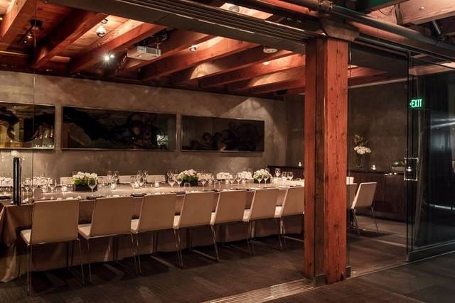 Elegant event space with long table, ideal for corporate meetings and private celebrations.