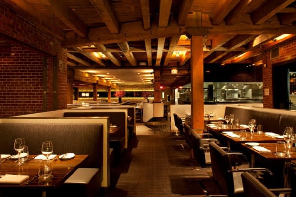 Stylish restaurant interior with brick walls, perfect for private dining events.