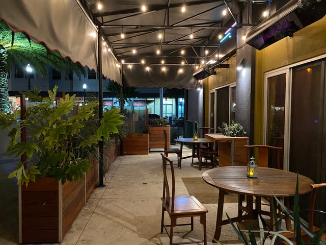 Colorful outdoor dinette at Sheba Piano Lounge, ideal for networking events and celebrations.