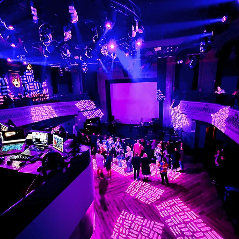 Concert hall at 46 Minna with elevated stage, perfect for dynamic events and gatherings.