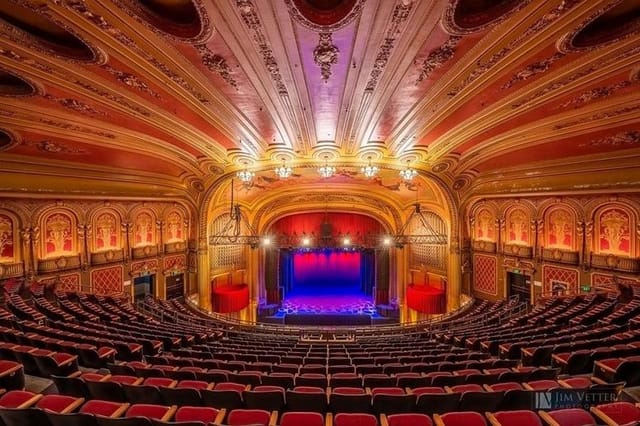 Ornate concert hall with plush seating, ideal for high-profile events and performances.