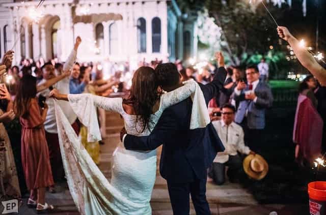 Joyful wedding celebration at CSH Veranda with sparklers and enchanting ambiance.