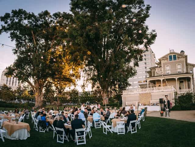 CSH Veranda outdoor event space with white chairs, ideal for weddings and corporate gatherings.
