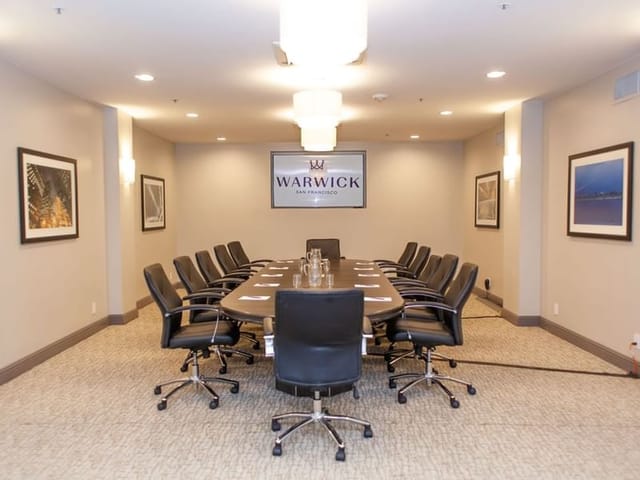 Conference room with polished table and ergonomic chairs for corporate meetings.