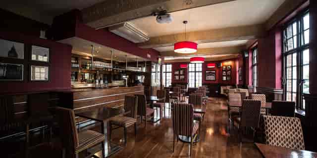 Function Room at The Barley Mow, warm ambiance, ideal for networking events and receptions.