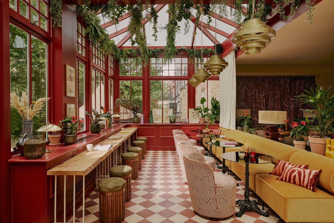 Stylish event space in EVE Kensington with vibrant decor and natural light for gatherings.