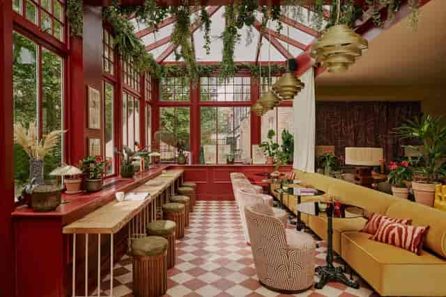 Stylish event space in EVE Kensington with vibrant decor and natural light for gatherings.