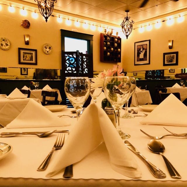Private dining room with elegant table setting for intimate meetings and events.